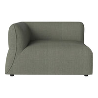 Green upholstered modular sofa with a smooth, curved design and subtle texture. Perfect for modern interiors.