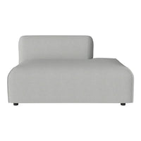 Light gray modular sofa with a minimalist design and smooth fabric texture, ideal for modern interiors.