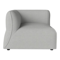 Light gray curved sofa with a smooth texture and minimalist design, perfect for contemporary interiors.