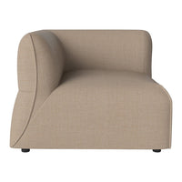 Beige upholstered sofa with a smooth, textured finish and curved silhouette. Ideal for modern decor.