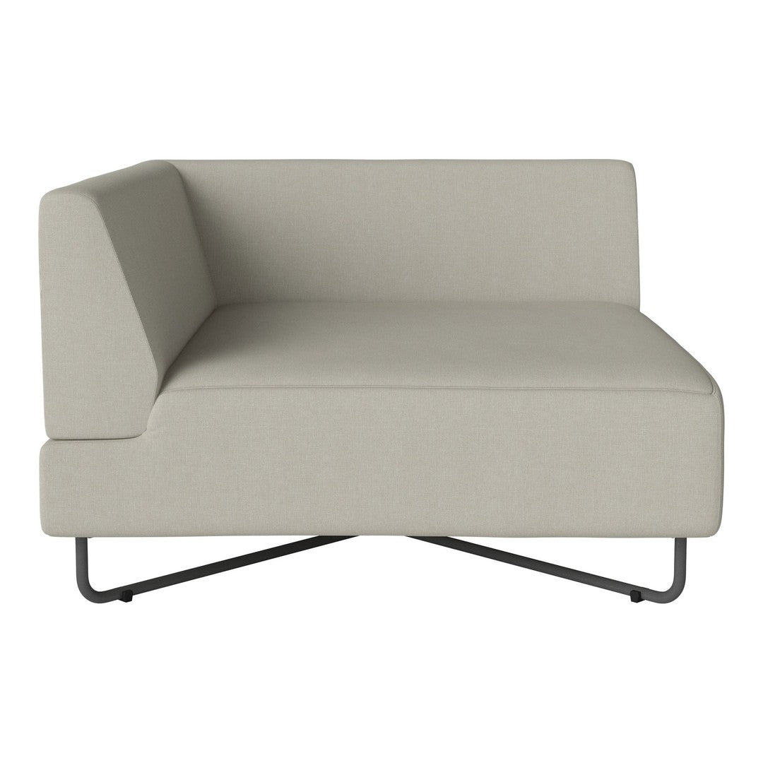 Light beige sofa section with a minimalist design and smooth fabric texture, featuring a sleek black metal base.