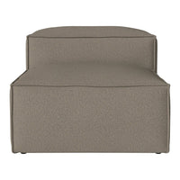 Taupe upholstered lounge chair with a textured surface and minimalist design, perfect for modern interiors.