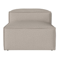Beige upholstered ottoman with a smooth, textured surface, offering a minimalist and neutral aesthetic.