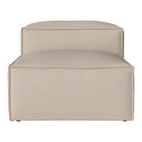 Beige upholstered lounge chair with a smooth, textured finish and minimalist design. Perfect for modern decor.