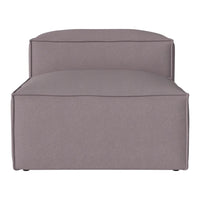 Gray upholstered lounge chair with a smooth, minimalist design and clean lines. Perfect for modern interiors.