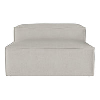 Light beige upholstered lounge chair with a smooth, minimalist design and subtle texture. Ideal for modern decor.