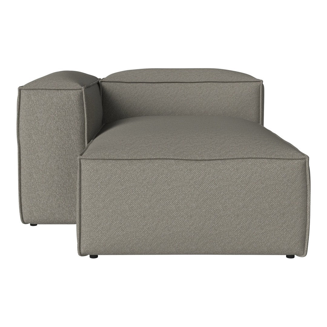 Modern chaise lounge in a textured gray fabric, featuring clean lines and a minimalist design for contemporary interiors.