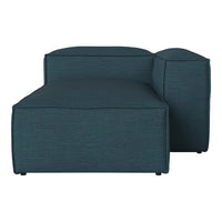 Teal fabric sectional sofa with a smooth texture and modern design, showcasing clean lines and a minimalist style.