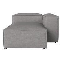 Gray modular sofa with a smooth, textured fabric and subtle, minimalist design. Ideal for modern living spaces.