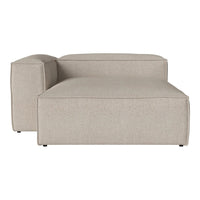 Light beige sectional sofa with a smooth, textured pattern, featuring clean lines and minimalistic design.