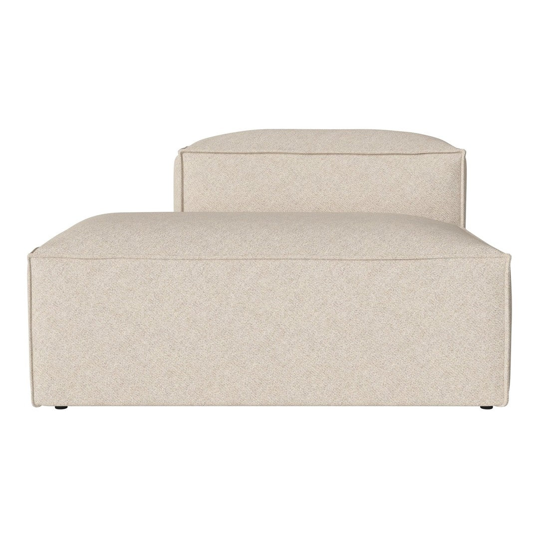Beige upholstered sofa with a smooth, textured finish, featuring a minimalist design and subtle patterns.