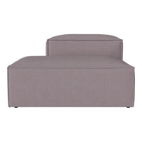 Gray upholstered chaise lounge with a clean, modern design and subtle texture. Perfect for contemporary decor.
