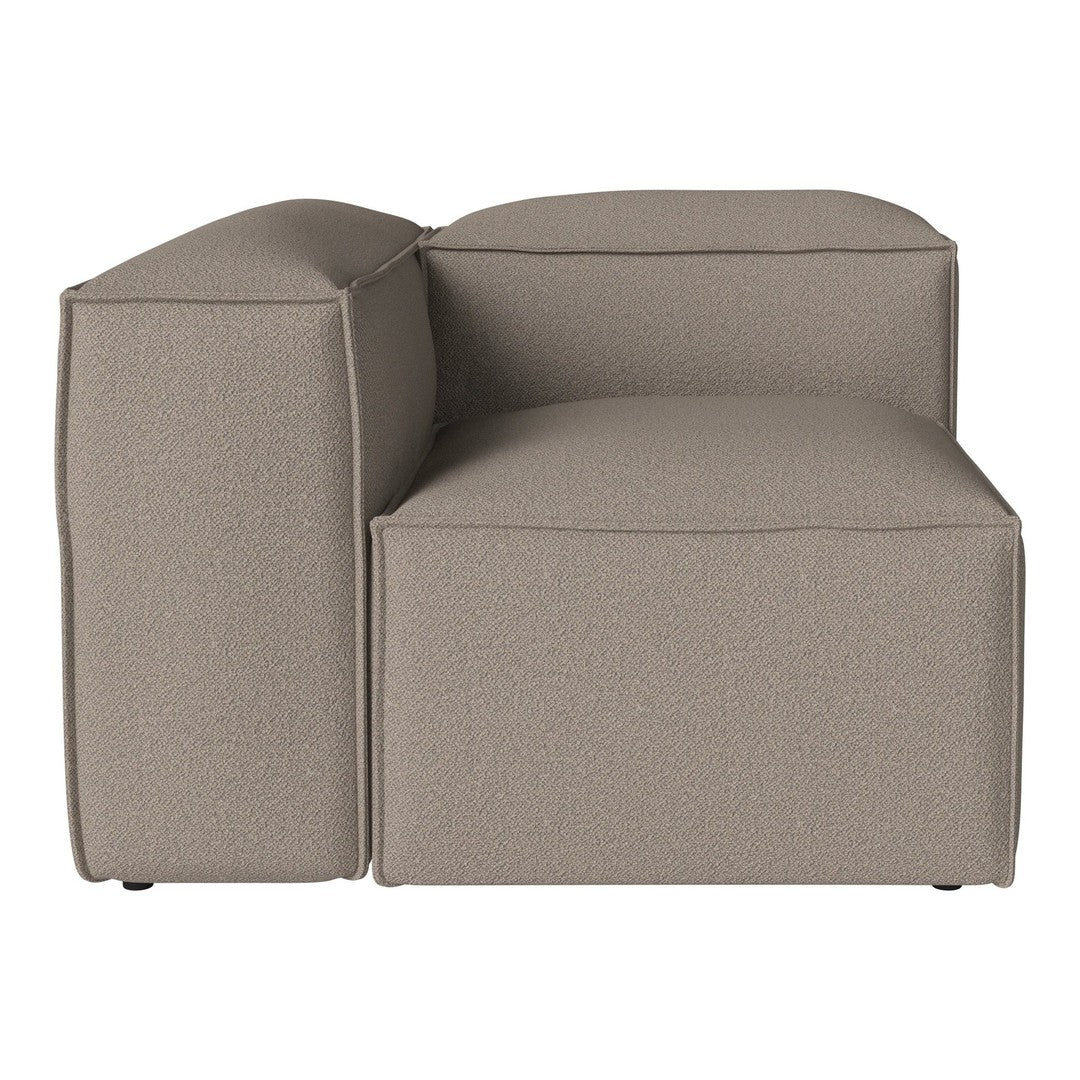 Beige upholstered sectional couch with a smooth, textured fabric and clean, modern lines. Perfect for minimalist decor.