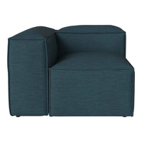 Teal upholstered armchair with a modern, minimalist design and textured fabric pattern.