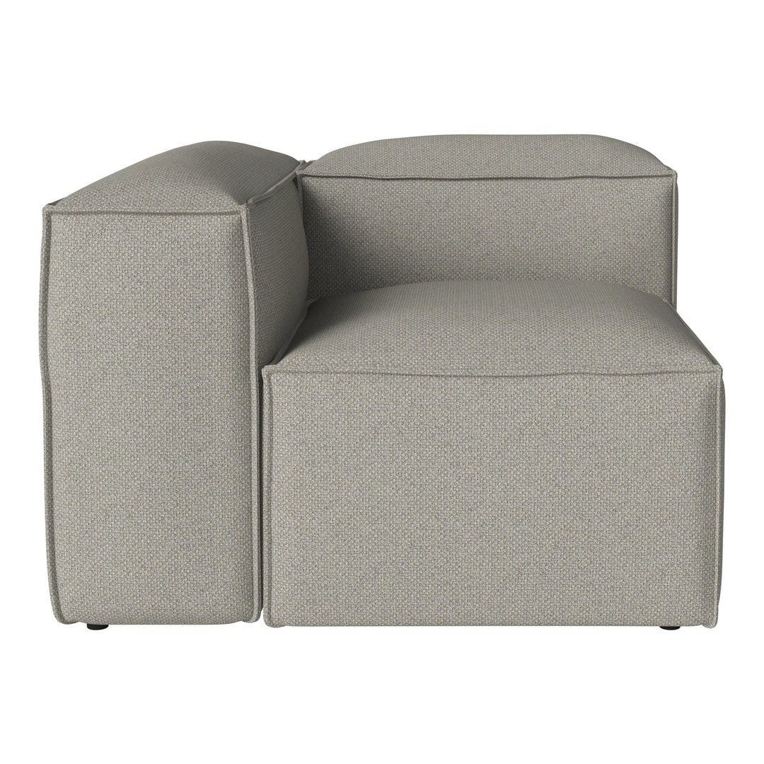 Gray textured sectional chair with a modern, minimalist design. Features clean lines and soft, neutral tones.