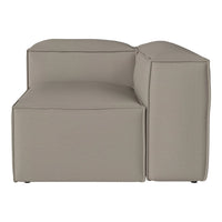 Beige modular sofa with a smooth, textured fabric and clean, minimalist design. Ideal for modern living spaces.