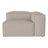 Beige upholstered sectional sofa with a textured, smooth finish and clean, modern lines.