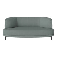 Curved, modern sofa in soft, muted teal fabric with a smooth texture and minimalist design. Perfect for contemporary spaces.