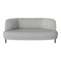 Light grey curved sofa with a smooth, minimalist design and no patterns, featuring sleek metal legs.