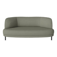 Sleek round sofa in soft sage green upholstery, featuring a minimalist design and smooth, clean lines.