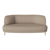 Minimalist beige curved sofa with smooth upholstery and light wooden legs, perfect for modern decor.