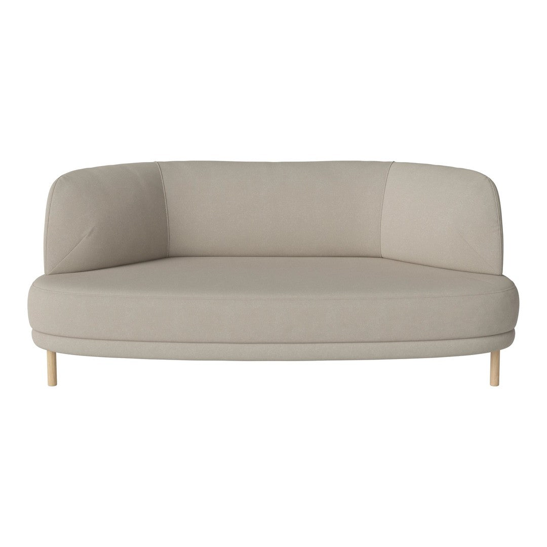 Curved beige sofa with a soft fabric finish and light wood legs, featuring a minimalistic design and contemporary style.
