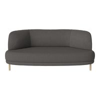 Modern curved sofa in dark gray fabric with minimalist design and light wood legs. Perfect for contemporary spaces.
