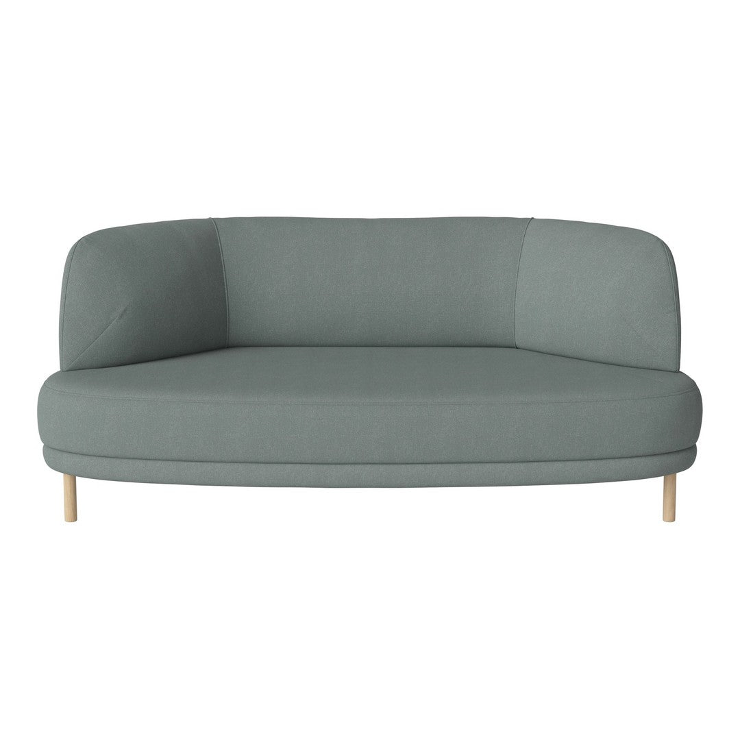 Light teal curved sofa with a smooth fabric surface and natural wooden legs, minimalist design.