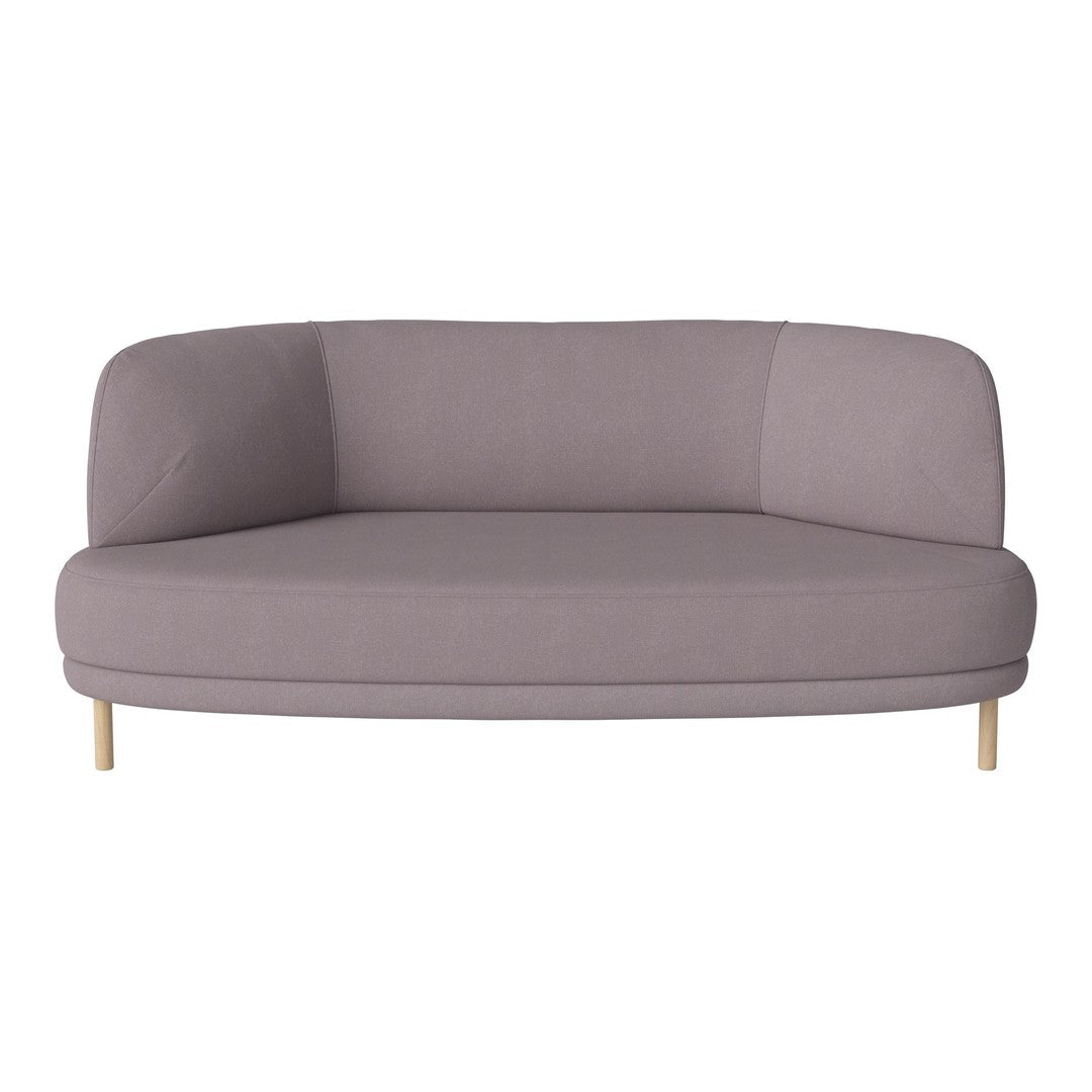 Soft lavender curved sofa with minimalist design and light wooden legs, featuring a smooth, solid fabric texture.