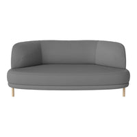 Curved gray sofa with a sleek design and natural wood legs, featuring a smooth fabric texture. Perfect for modern decor.