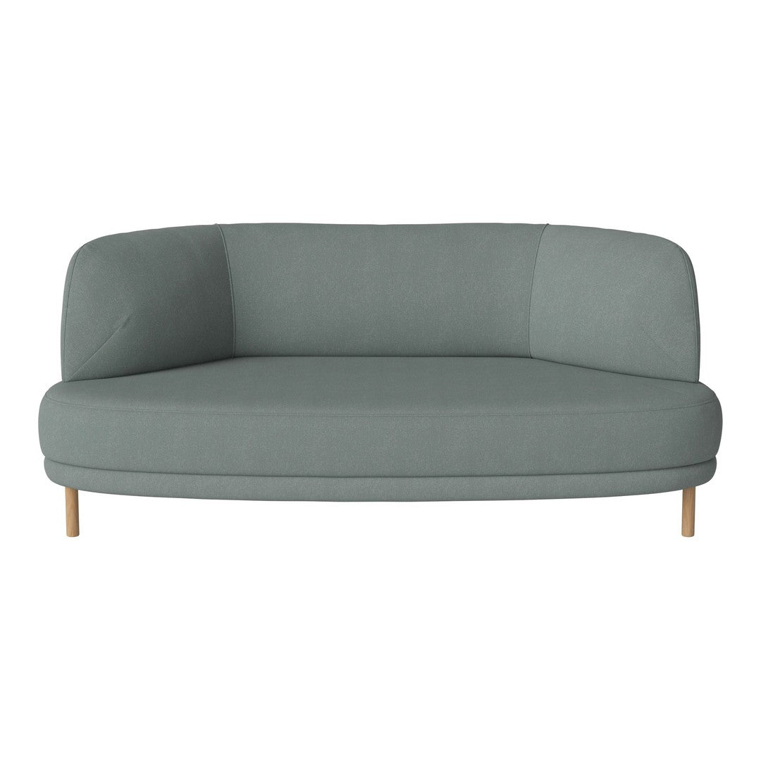Curved, modern sofa in soft sage green fabric with natural wood legs, perfect for contemporary living spaces.
