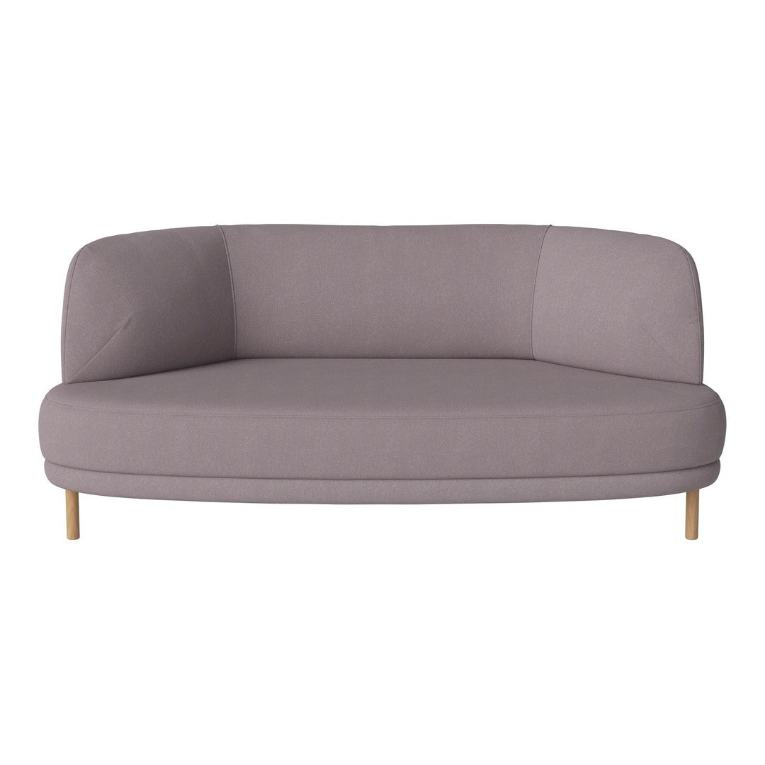 Soft lavender curved sofa with smooth upholstery and natural wooden legs, perfect for modern living spaces.