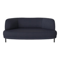 Navy blue upholstered curved sofa with a smooth texture and minimalist design, complemented by black metal legs.