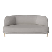 Curved light gray sofa with a smooth texture and wooden legs, featuring a modern minimalist design.