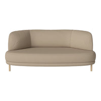 Beige curved loveseat with smooth upholstery and light wooden legs, perfect for modern living spaces.
