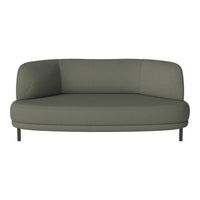Curved green sofa with a textured fabric and minimalist design, featuring sleek metal legs for modern elegance.