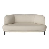 Beige curved sofa with smooth fabric, featuring a minimalist design and elegant, modern lines. Perfect for any decor.