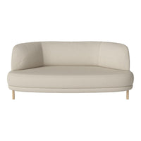Cream-colored, curved sofa with smooth fabric and light wooden legs, offering a minimalist and modern design.