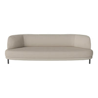 Beige curved sofa with smooth upholstery and minimalistic design, set on sleek black legs. Perfect for modern interiors.