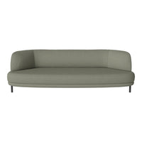 Stylish curved sofa in soft sage green fabric with a smooth texture and minimalist design. Ideal for modern decor.