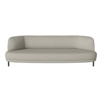 Light grey curved sofa with smooth, minimalist design and sleek black legs, ideal for modern decor.