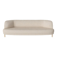 Light beige curved sofa with a smooth, textured fabric and wooden legs, perfect for minimalist decor.