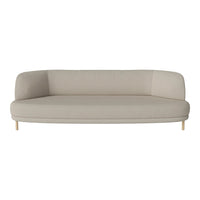 Light beige curved sofa with a smooth, minimalist design and wooden legs. Perfect for modern interiors.