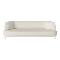 Minimalist white curved sofa with smooth texture and natural wood legs, perfect for modern decor.