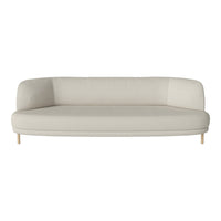 Modern beige curved sofa with minimalist design and light wood legs. Ideal for contemporary living spaces.