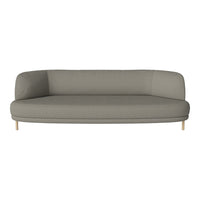 Stylish light gray curved sofa with a smooth texture and wooden legs, perfect for modern interiors.