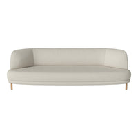 Light beige curved sofa with a smooth fabric finish and natural wooden legs. Ideal for modern living spaces.