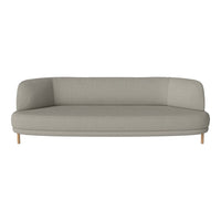 Light gray curved sofa with a smooth texture and wooden legs, perfect for modern living spaces.