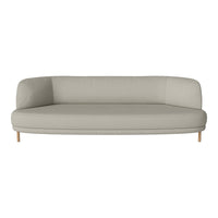 Light gray curved sofa with a smooth texture and wooden legs, perfect for modern living spaces.