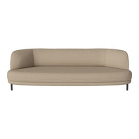 Beige curved sofa with smooth fabric and minimalist design, featuring sleek black metal legs.